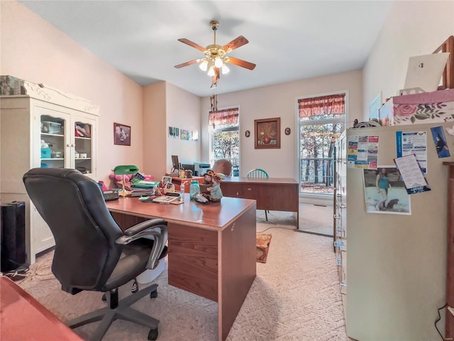 office featuring ceiling fan and light colored carpet