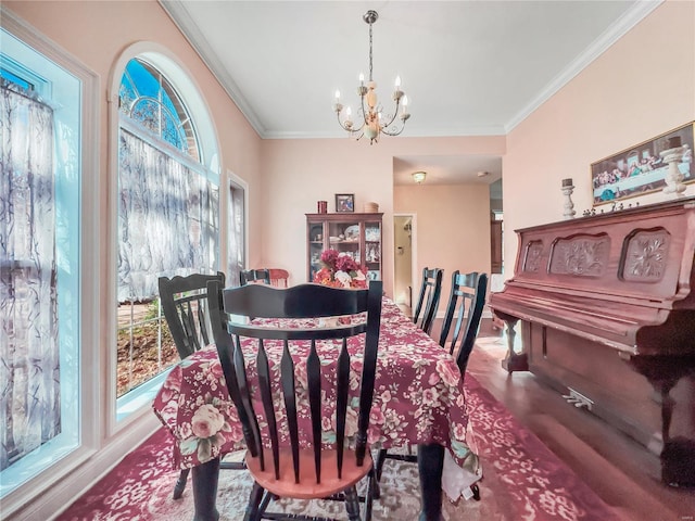 dining space with a chandelier and ornamental molding