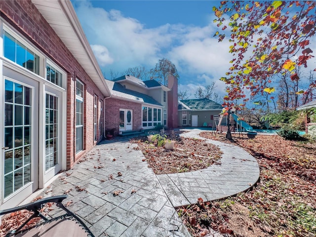 view of patio featuring a playground