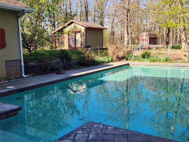 view of swimming pool featuring fence