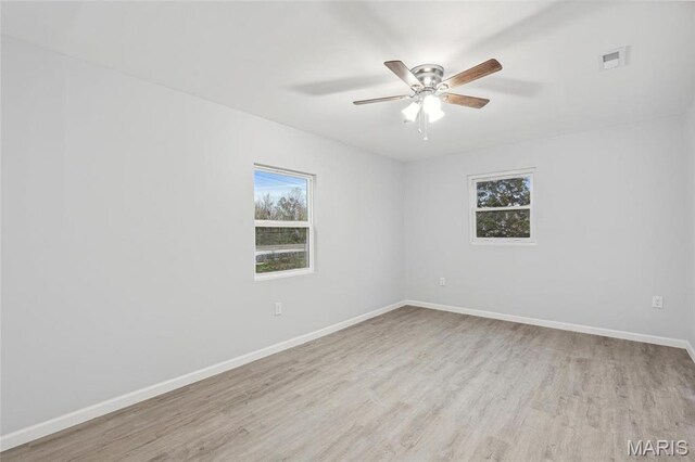 1005 Belleau Creek Rd, Saint Peters, MO 63366 - empty room featuring plenty of natural light, wood finished floors, baseboards, and ceiling fan