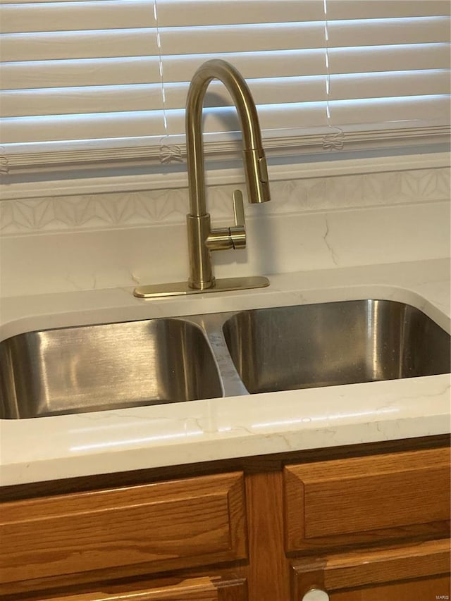 6550 E Dolphin Cir E, Florissant, MO 63033 - kitchen view of a sink and brown cabinetry