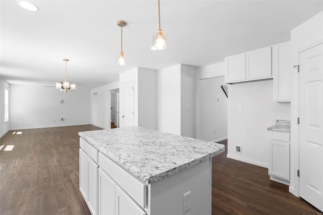 3139 White Pine Dr, Imperial, MO 63052 - kitchen featuring dark wood-style flooring, a chandelier, a center island, and white cabinetry
