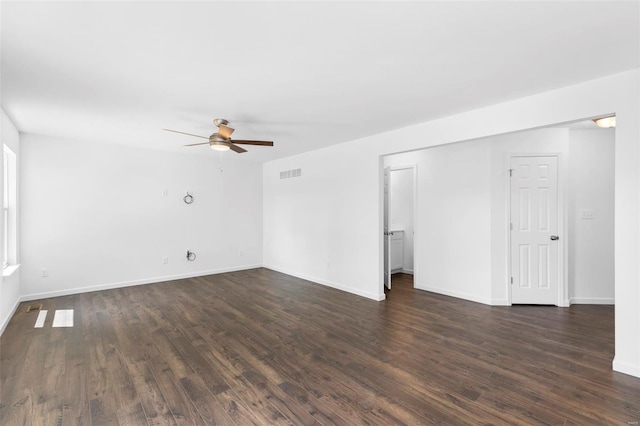 3139 White Pine Dr, Imperial, MO 63052 - unfurnished living room with a ceiling fan, dark wood finished floors, and baseboards