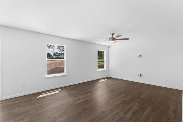 3139 White Pine Dr, Imperial, MO 63052 - unfurnished room with healthy amount of natural light, dark wood finished floors, ceiling fan, and baseboards