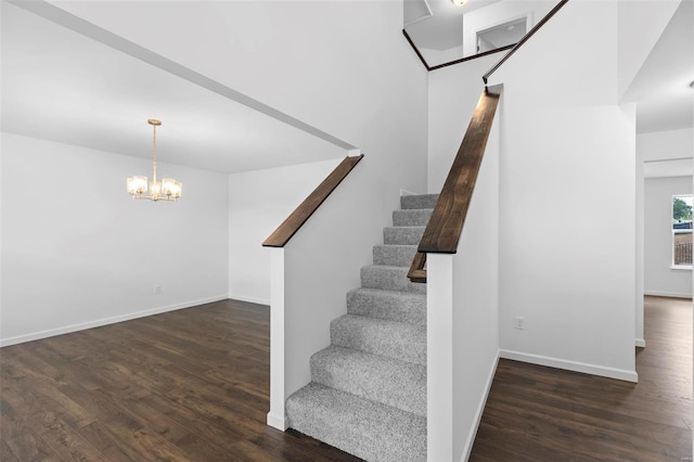 3139 White Pine Dr, Imperial, MO 63052 - stairs with wood finished floors, baseboards, and a chandelier