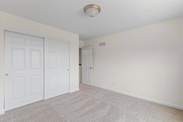 3139 White Pine Dr, Imperial, MO 63052 - unfurnished bedroom featuring light colored carpet, baseboards, and a closet