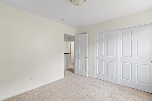 3139 White Pine Dr, Imperial, MO 63052 - unfurnished bedroom featuring light carpet, baseboards, and a closet