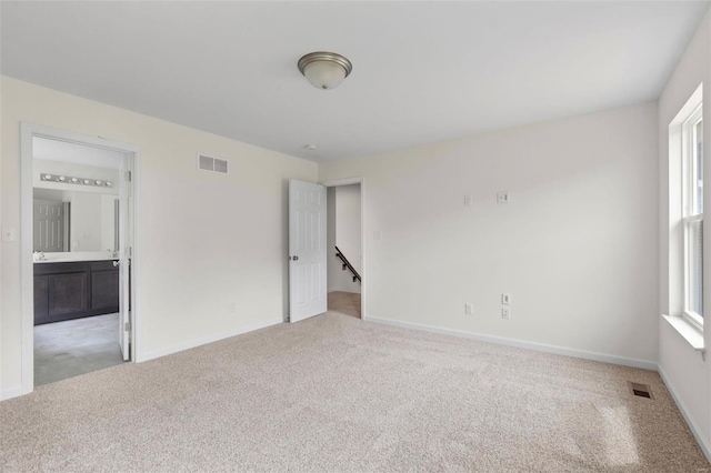 3139 White Pine Dr, Imperial, MO 63052 - unfurnished bedroom with carpet floors, baseboards, and ensuite bath