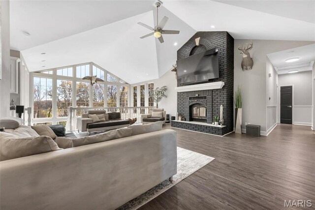 809 Peruque View Ct, Wentzville, MO 63385 - living room featuring high vaulted ceiling, a ceiling fan, a fireplace, dark wood-style flooring, and baseboards