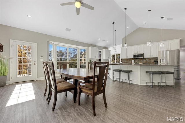 809 Peruque View Ct, Wentzville, MO 63385 - dining space featuring wood finished floors, ceiling fan, and high vaulted ceiling