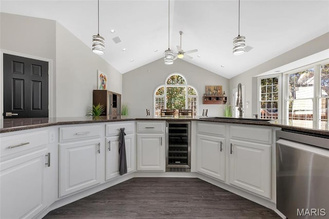 809 Peruque View Ct, Wentzville, MO 63385 - kitchen featuring wine cooler, dishwasher, a ceiling fan, vaulted ceiling, and white cabinetry