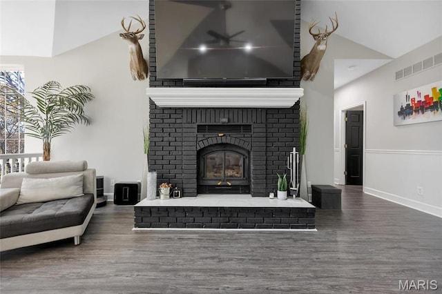809 Peruque View Ct, Wentzville, MO 63385 - living area featuring wood finished floors, baseboards, lofted ceiling, and a brick fireplace