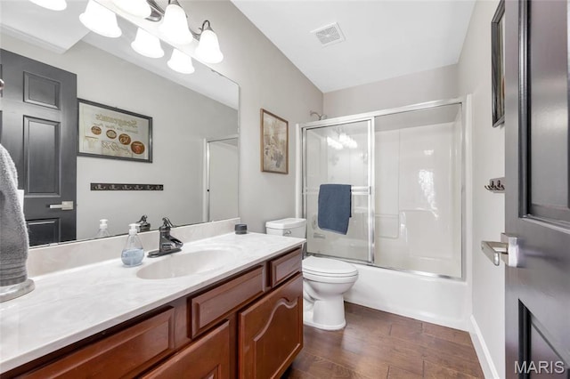 809 Peruque View Ct, Wentzville, MO 63385 - bathroom with toilet, wood finished floors, vanity, and shower / bath combination with glass door