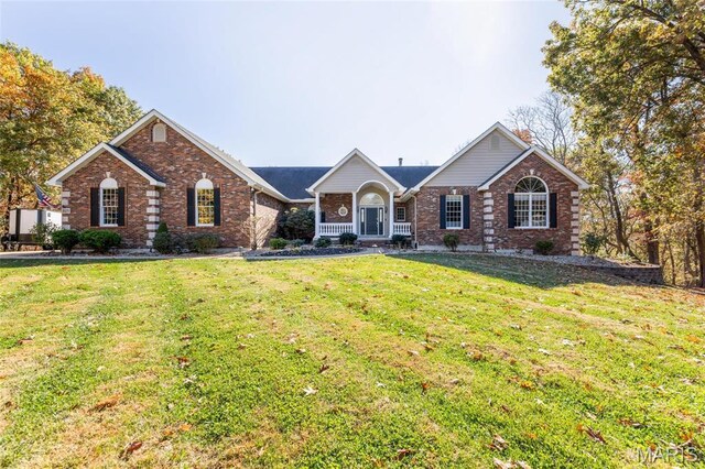 809 Peruque View Ct, Wentzville, MO 63385 - view of front of property with brick siding, a front yard, and a chimney
