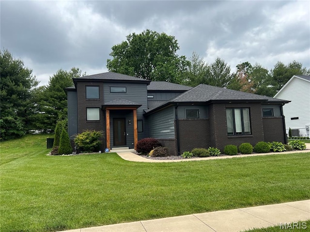 3723 Cabernet Ln, Edwardsville, IL 62025 - prairie-style house featuring brick siding, a front yard, and a shingled roof