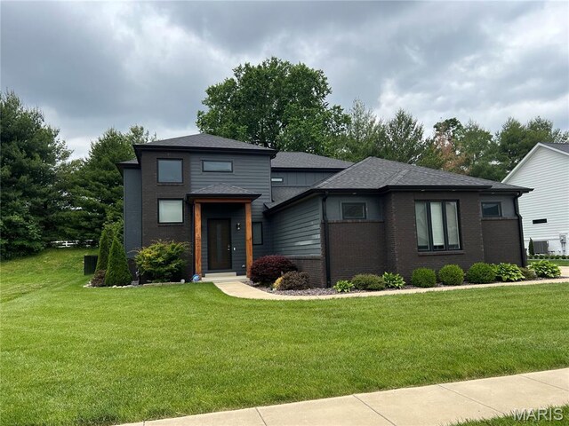 3723 Cabernet Ln, Edwardsville, IL 62025 - prairie-style house featuring a front yard, brick siding, and roof with shingles
