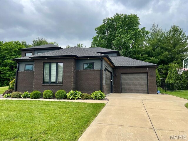 3723 Cabernet Ln, Edwardsville, IL 62025 - prairie-style house with driveway, a garage, brick siding, and roof with shingles