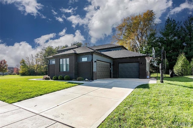 3723 Cabernet Ln, Edwardsville, IL 62025 - prairie-style house featuring an attached garage, a front yard, driveway, and brick siding