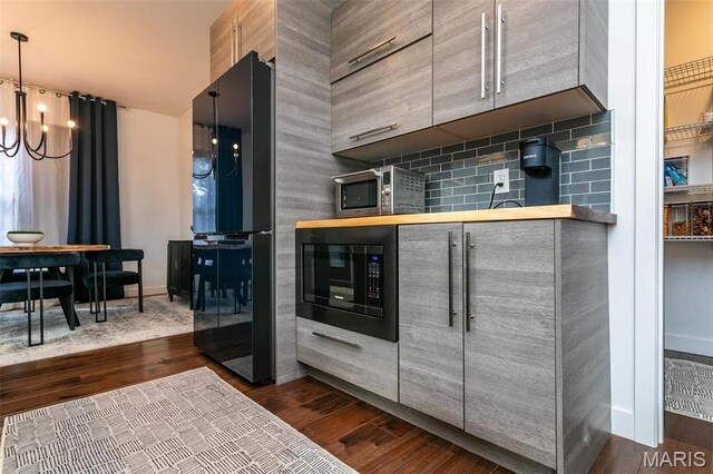 3723 Cabernet Ln, Edwardsville, IL 62025 - kitchen with built in microwave, freestanding refrigerator, dark wood-style flooring, a chandelier, and gray cabinets