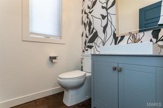 3723 Cabernet Ln, Edwardsville, IL 62025 - bathroom featuring baseboards, wood finished floors, toilet, and vanity