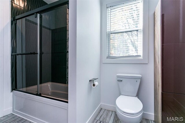 3723 Cabernet Ln, Edwardsville, IL 62025 - bathroom featuring baseboards, plenty of natural light, shower / bath combination with glass door, and toilet