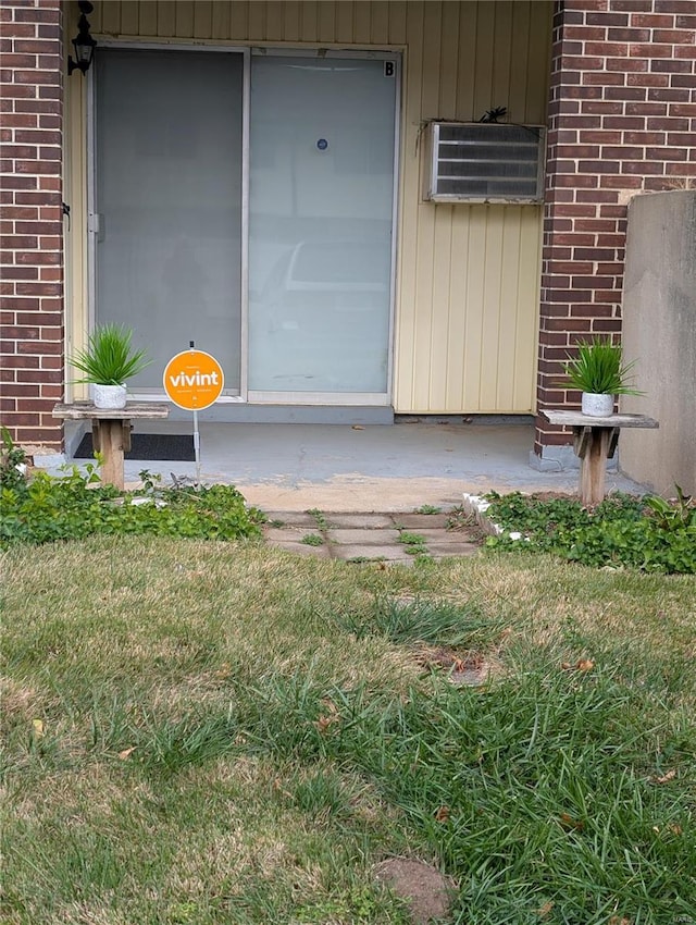 property entrance featuring brick siding