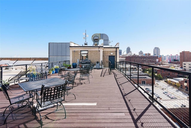 wooden terrace featuring a city view