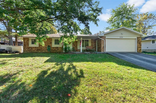 2230 Kent Dr, Cape Girardeau, MO 63701 - ranch-style house with a garage, concrete driveway, brick siding, and a front lawn