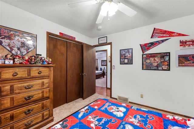 2230 Kent Dr, Cape Girardeau, MO 63701 - carpeted bedroom with a closet, a ceiling fan, a textured ceiling, and baseboards