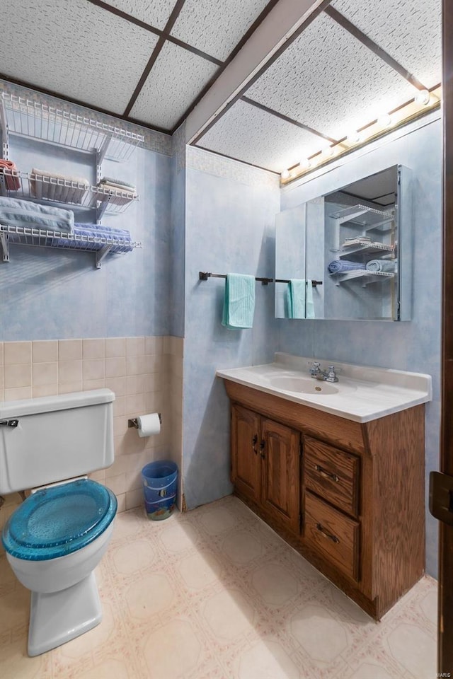 2230 Kent Dr, Cape Girardeau, MO 63701 - bathroom featuring toilet, tile walls, vanity, and tile patterned floors