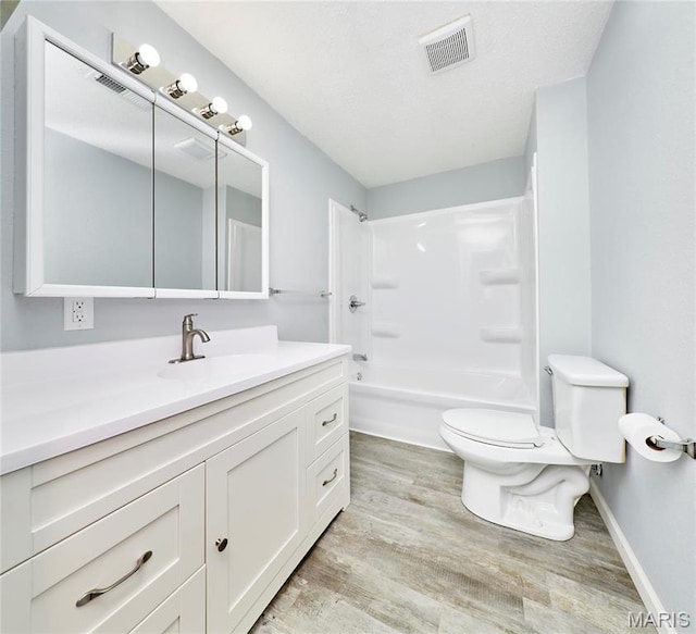 10994 Webster Rd, Caledonia, MO 63631 - full bathroom featuring vanity, wood finished floors, and bathing tub / shower combination