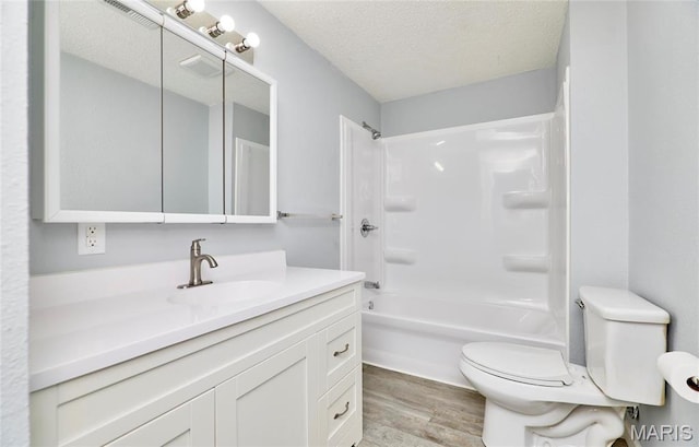 10994 Webster Rd, Caledonia, MO 63631 - bathroom featuring wood finished floors, vanity, shower / washtub combination, and a textured ceiling
