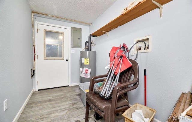 10994 Webster Rd, Caledonia, MO 63631 - mudroom with electric water heater, electric panel, wood finished floors, and a textured ceiling