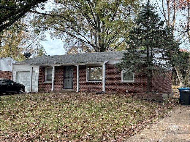 single story home with brick siding, a garage, roof with shingles, and a front lawn