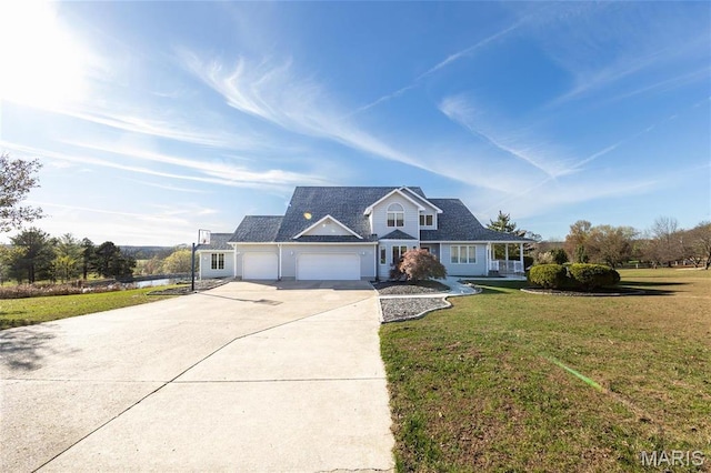 10605 Larson Ln, Rolla, MO 65401 - traditional-style house with a garage, driveway, a front yard, and a porch