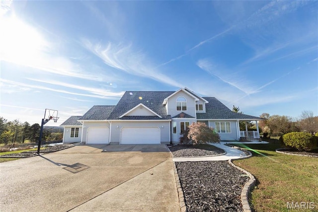 10605 Larson Ln, Rolla, MO 65401 - traditional-style home with concrete driveway, a garage, a front lawn, and roof with shingles