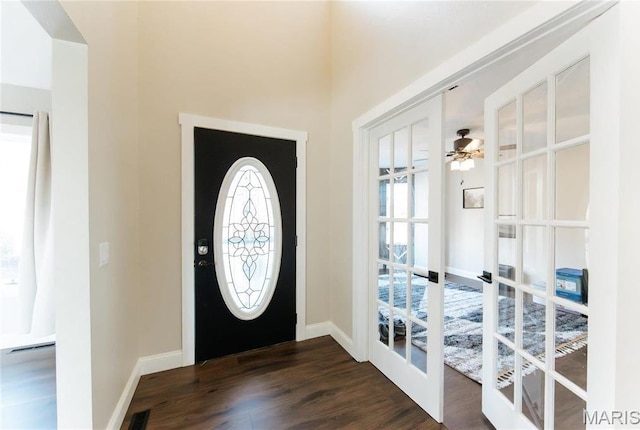10605 Larson Ln, Rolla, MO 65401 - foyer entrance with french doors, plenty of natural light, dark wood-style flooring, and baseboards