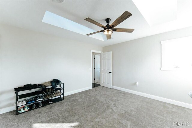 10605 Larson Ln, Rolla, MO 65401 - bedroom featuring carpet, baseboards, a skylight, and ceiling fan