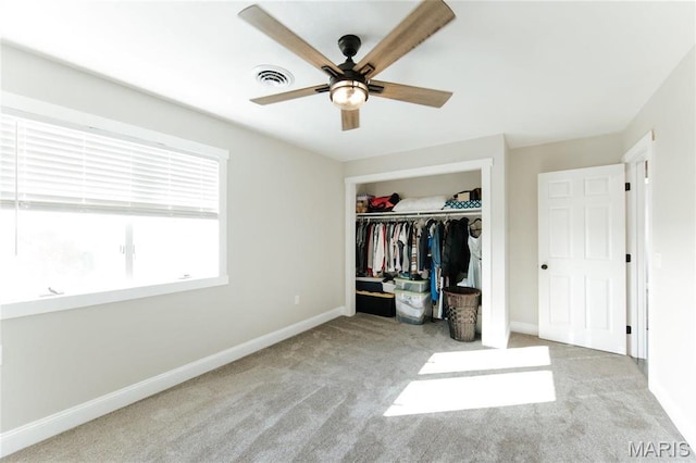 10605 Larson Ln, Rolla, MO 65401 - unfurnished bedroom featuring baseboards, carpet, a closet, and ceiling fan