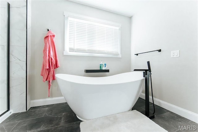 10605 Larson Ln, Rolla, MO 65401 - full bath featuring baseboards, a freestanding bath, and a stall shower