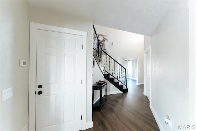10605 Larson Ln, Rolla, MO 65401 - entrance foyer with dark wood-style floors, stairs, and baseboards