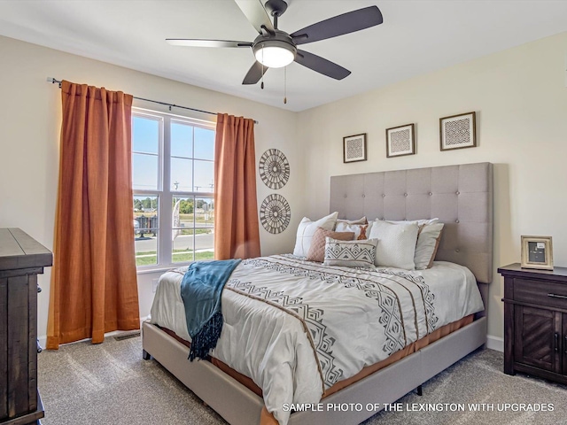 bedroom with carpet floors, ceiling fan, and baseboards
