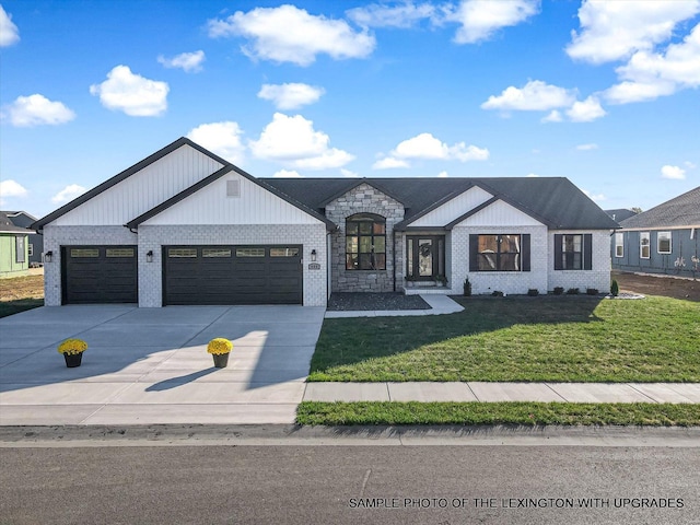 view of front facade featuring a garage, a front lawn, driveway, and brick siding