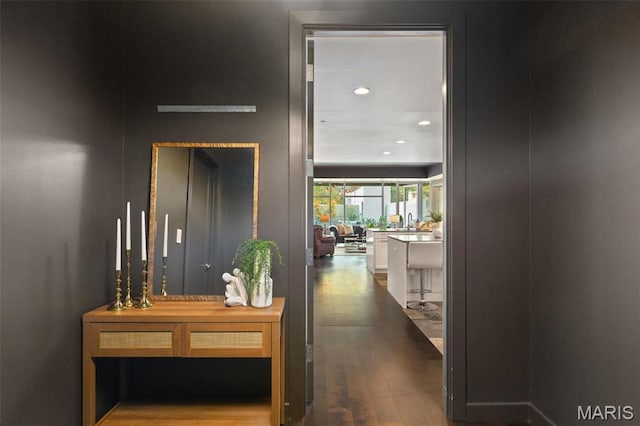 4545 Lindell Blvd Unit 3, Saint Louis, MO 63108 - hallway with dark wood-type flooring, recessed lighting, and a sink