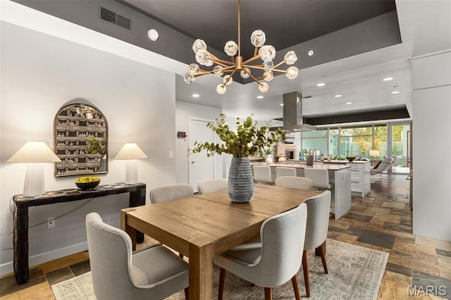 4545 Lindell Blvd Unit 3, Saint Louis, MO 63108 - dining space featuring stone tile flooring, a chandelier, recessed lighting, and baseboards