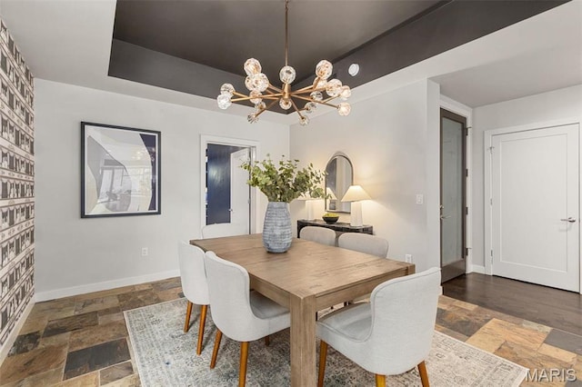 4545 Lindell Blvd Unit 3, Saint Louis, MO 63108 - dining space featuring a chandelier, stone tile flooring, and baseboards