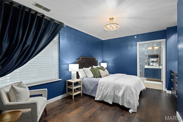 4545 Lindell Blvd Unit 3, Saint Louis, MO 63108 - bedroom with a chandelier, baseboards, and wood finished floors