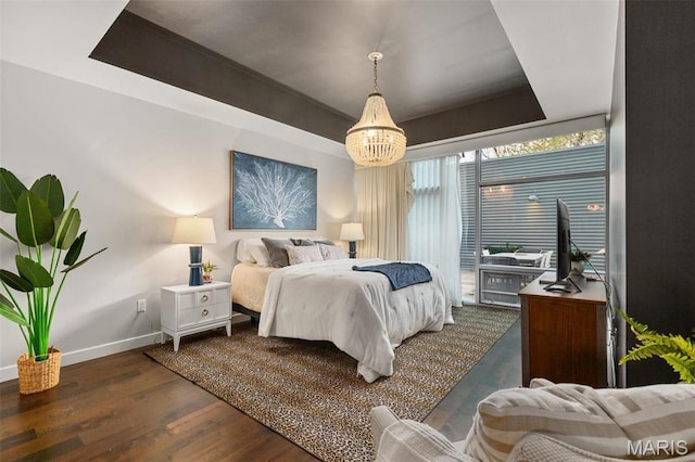4545 Lindell Blvd Unit 3, Saint Louis, MO 63108 - bedroom with baseboards, a chandelier, wood finished floors, and access to exterior