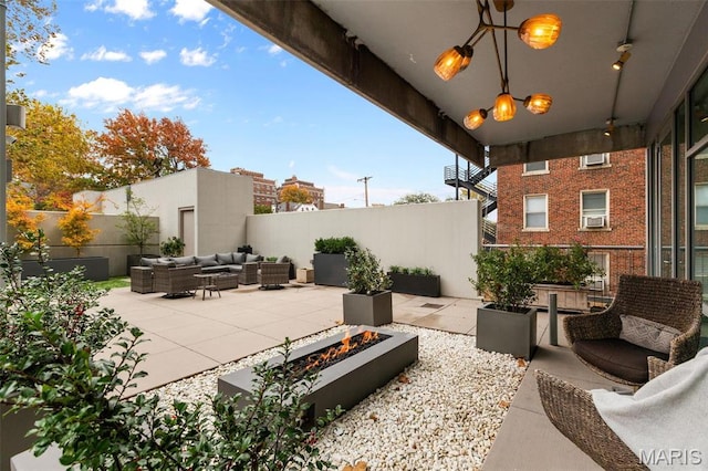 4545 Lindell Blvd Unit 3, Saint Louis, MO 63108 - view of patio featuring an outdoor living space with a fire pit